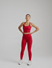 red high-waisted midi legging with criss cross front detail.