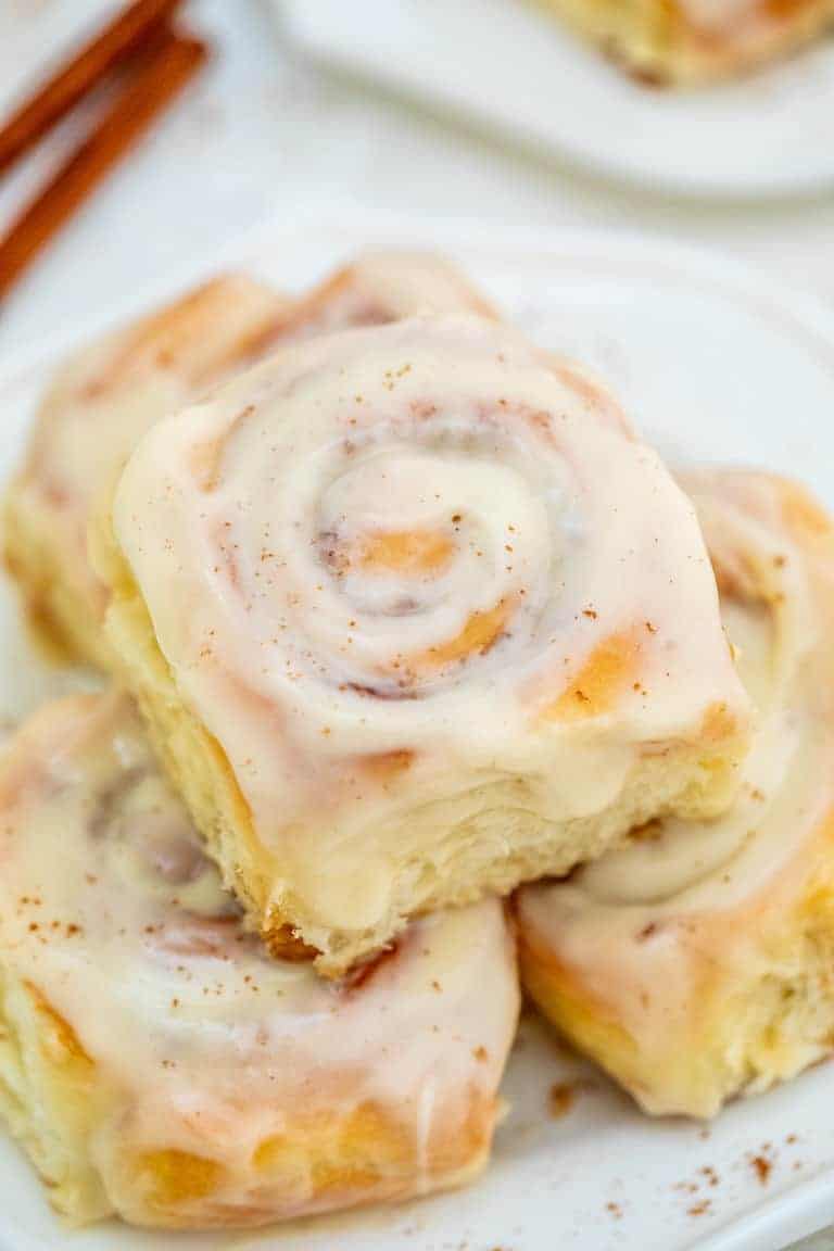 a plate of 3 instant pot cinnamon rolls ready to be served