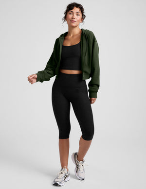 green fleece zip-up jacket with a drawstring hood. 