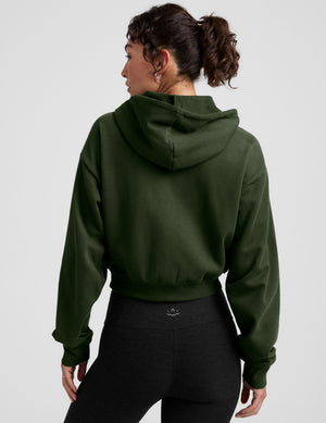 green fleece zip-up jacket with a drawstring hood. 