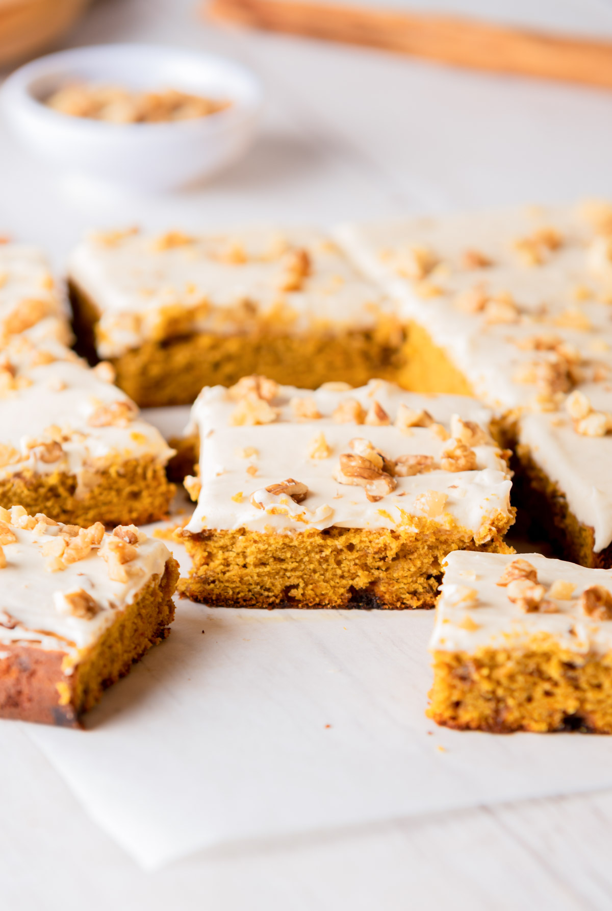 Slices of sheet cake on a white board.