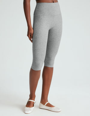 gray high-waisted pedal pusher length leggings.
