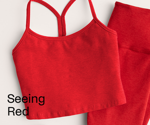 Red tank top and leggings set on a light gray background with 'Seeing Red' text.
